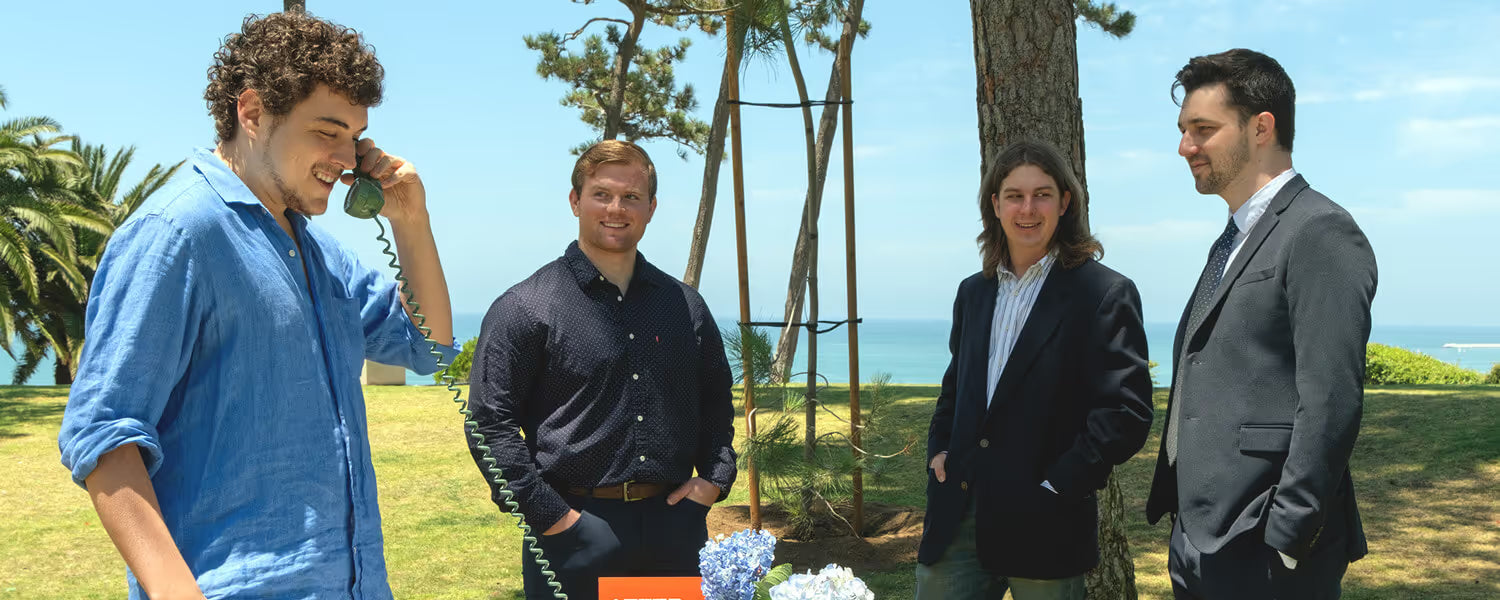 Four men at outdoor wedding leaving messages on an After the Tone audio guestbook