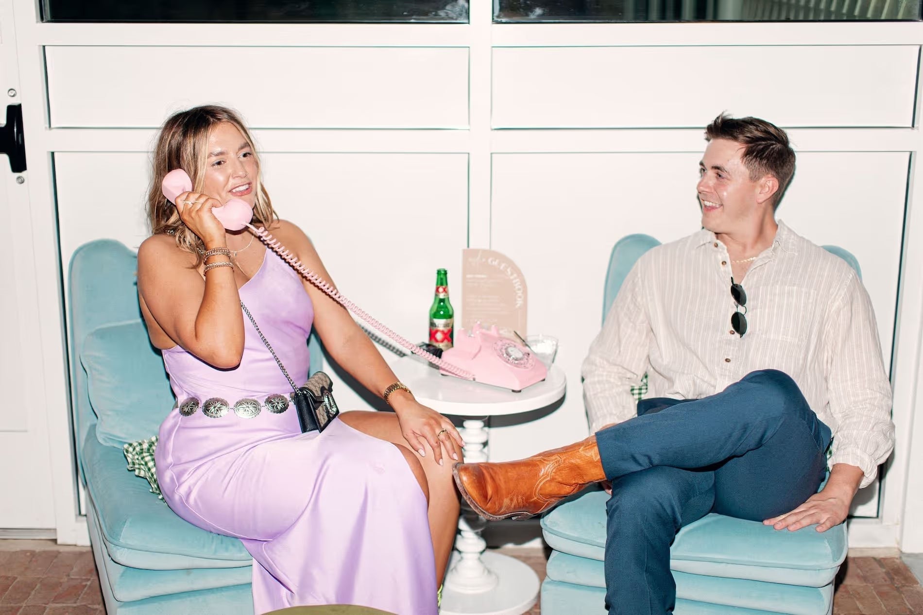 husband and wife holding leaving message on phone guestbook