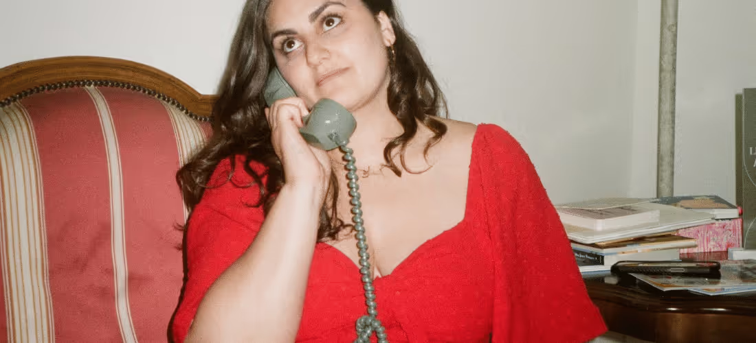 Girl holding an Audio Guestbook to her ear