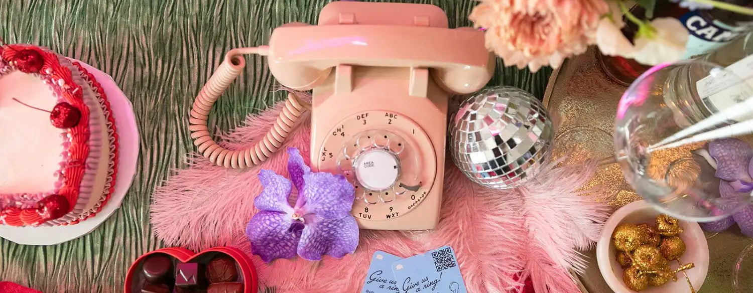 pink phone audio guestbook sitting on table with decorations