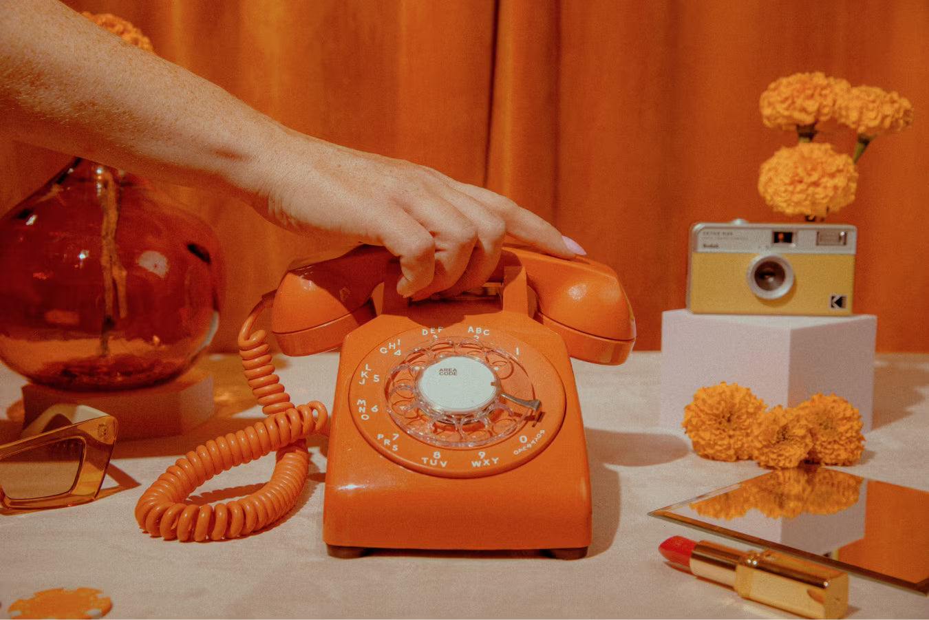Orange After the Tone phone set up on a table at a wedding