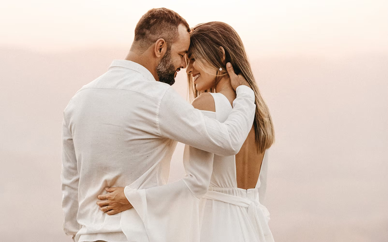 Husband and Wife embracing each other about a small wedding