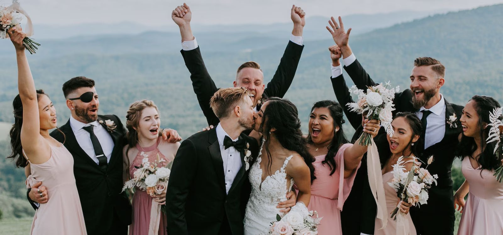 Wife and Groom are just married and surrounded by wedding party