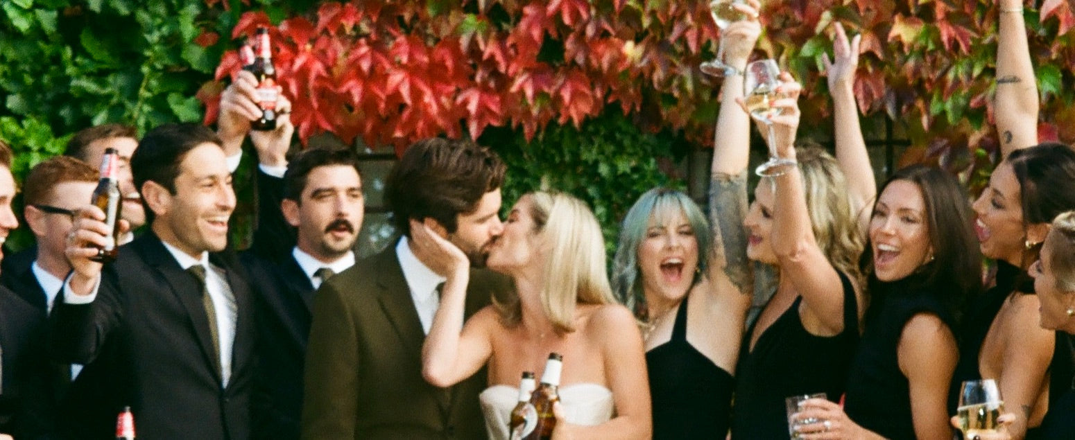 Bride and groom celebrate with their bridal party at their Italian wedding.