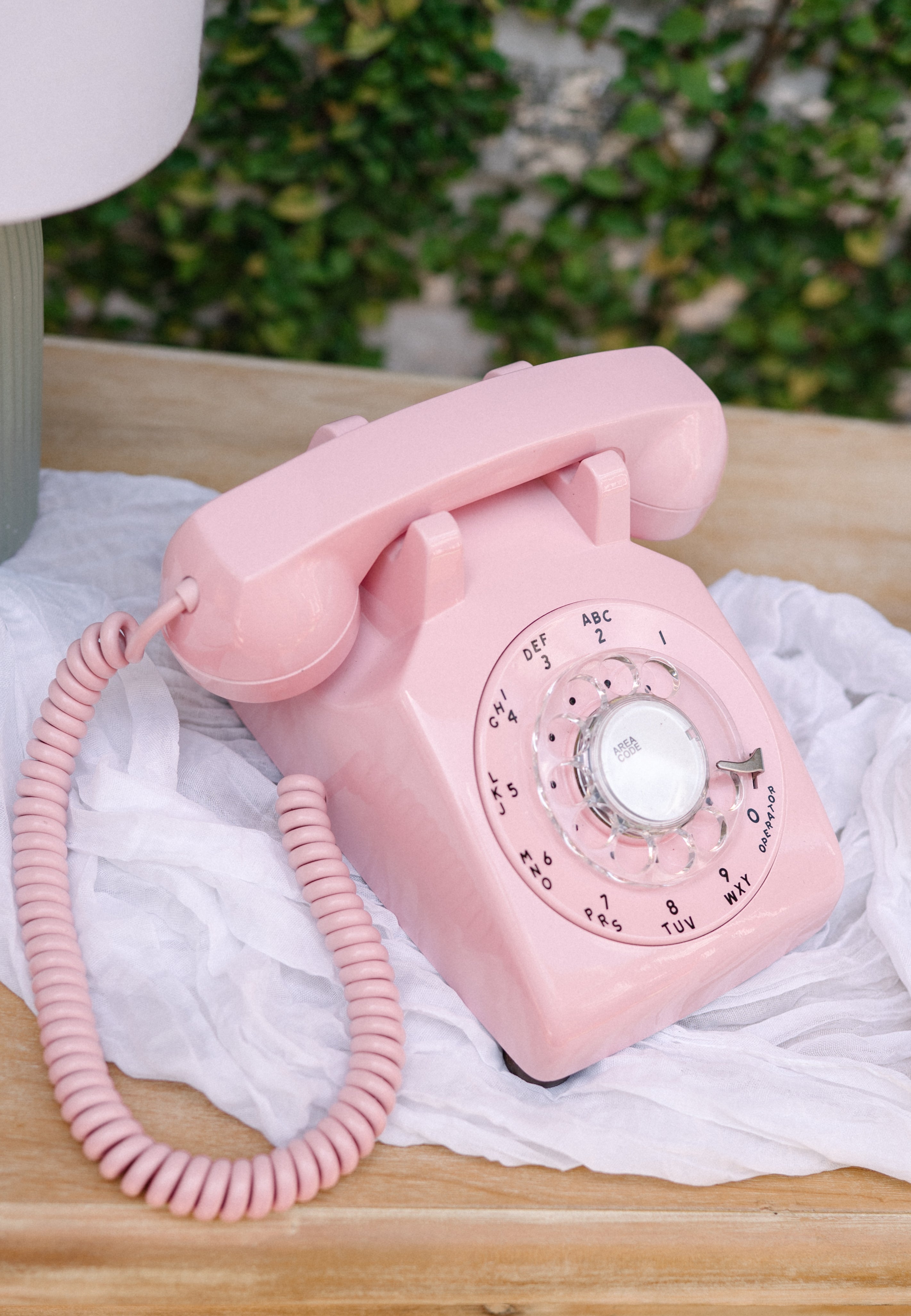 Pink audio guest book phone on event table