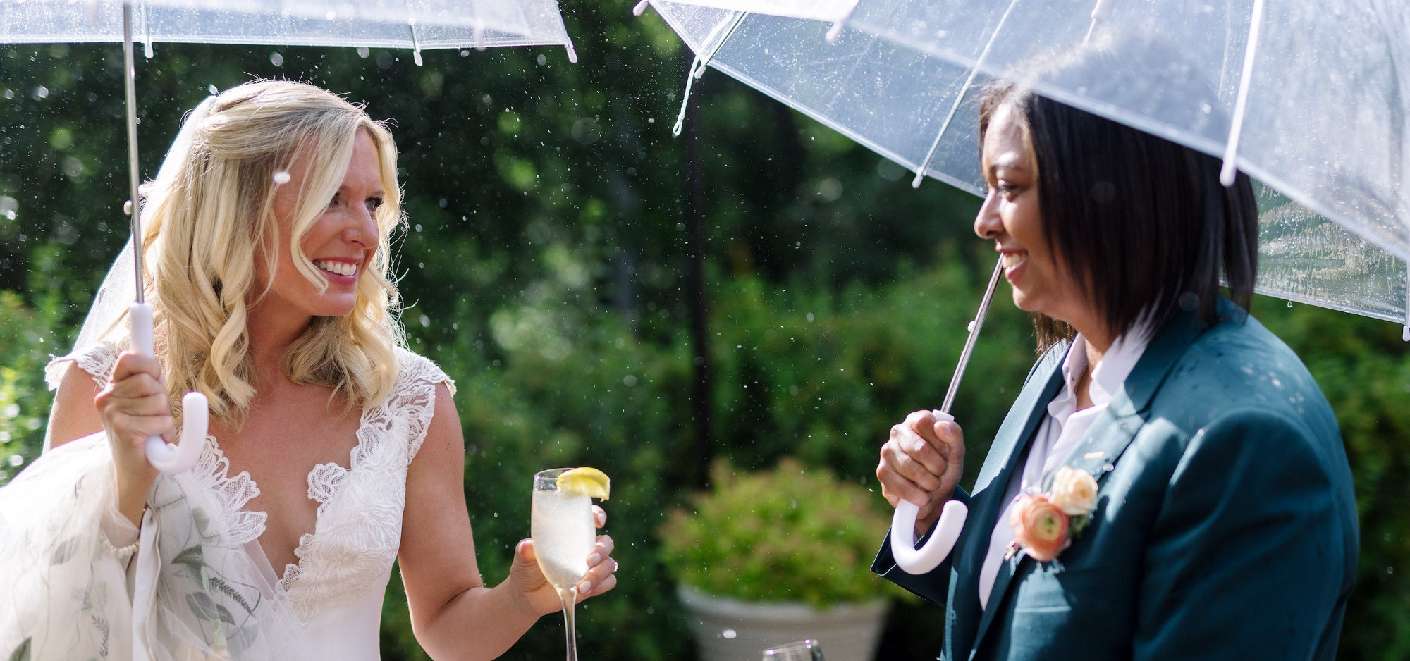 Two brides cheers each other on their wedding day in Colorado.