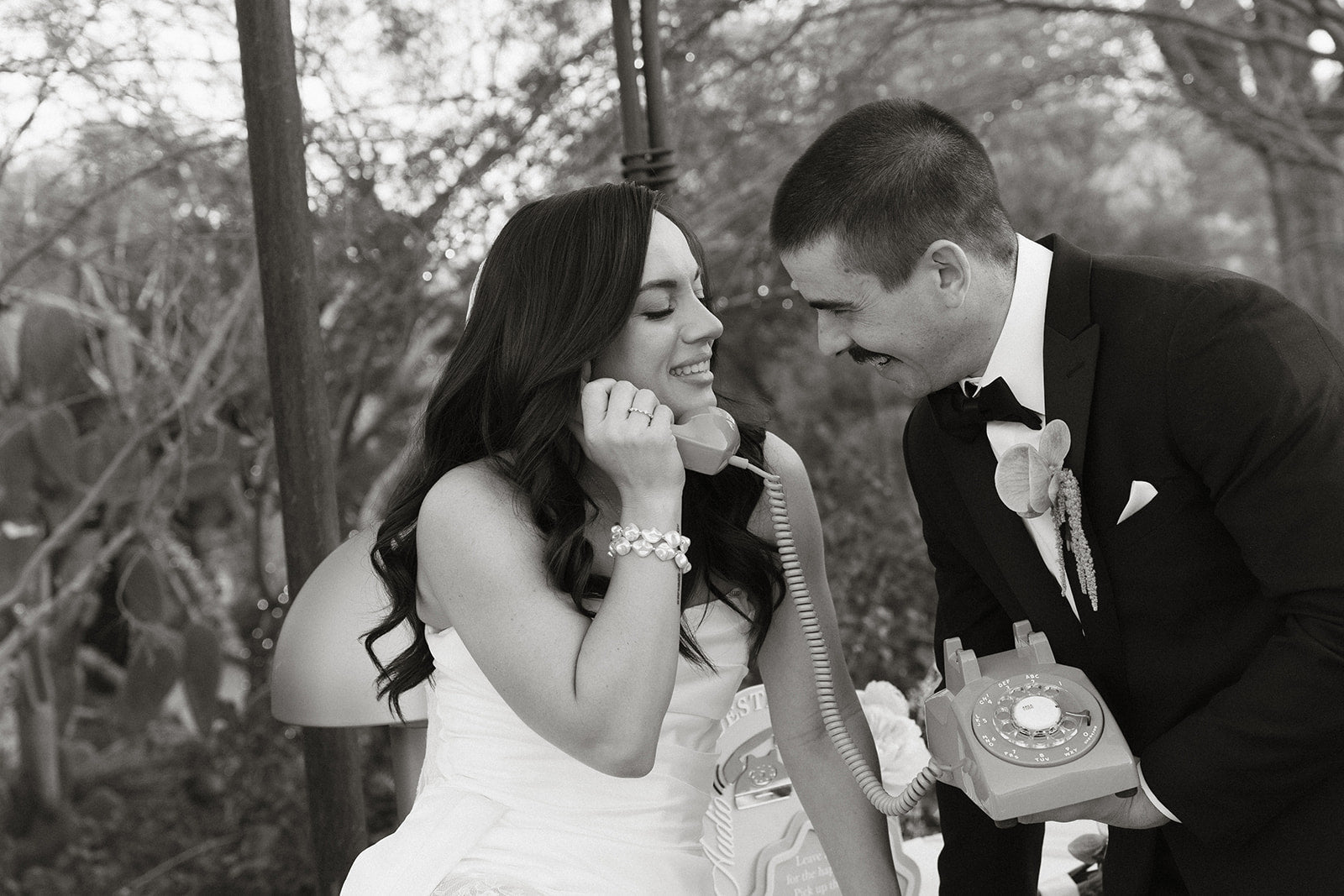 Husband and wife leave voicemail in black and white photo