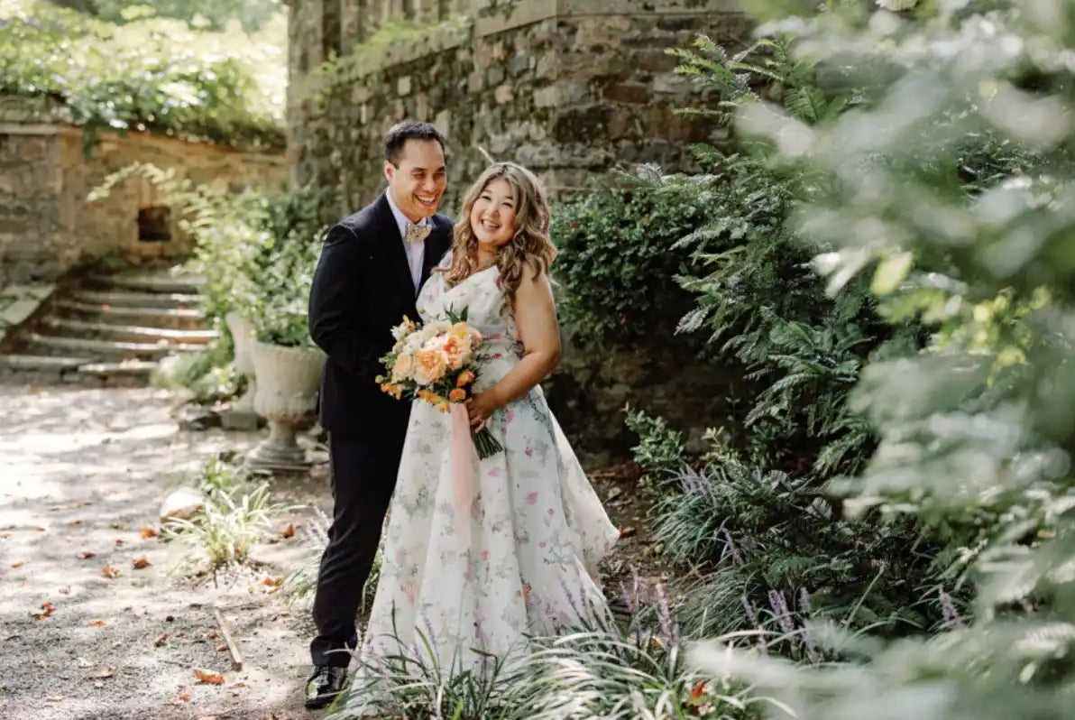 a couple taking wedding photos smiling