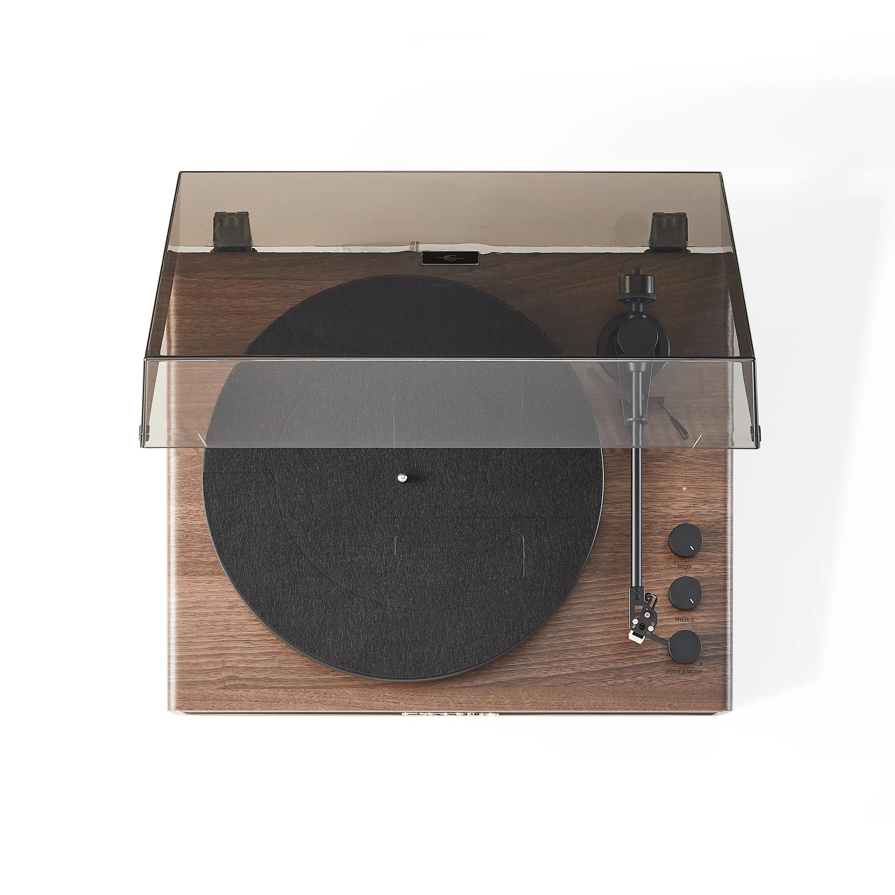 Wooden record player with clear dust cover on a white background