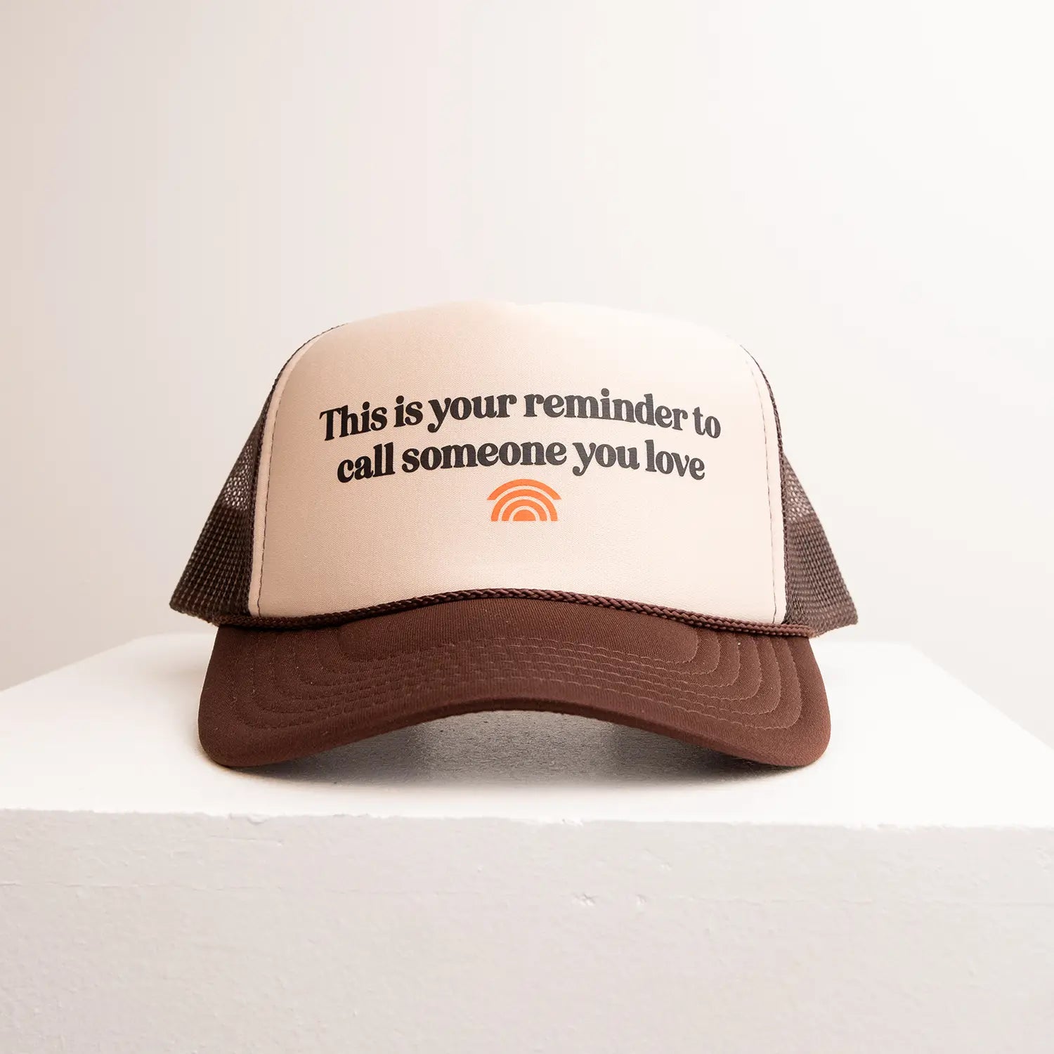 Trucker hat with text and logo on a white background