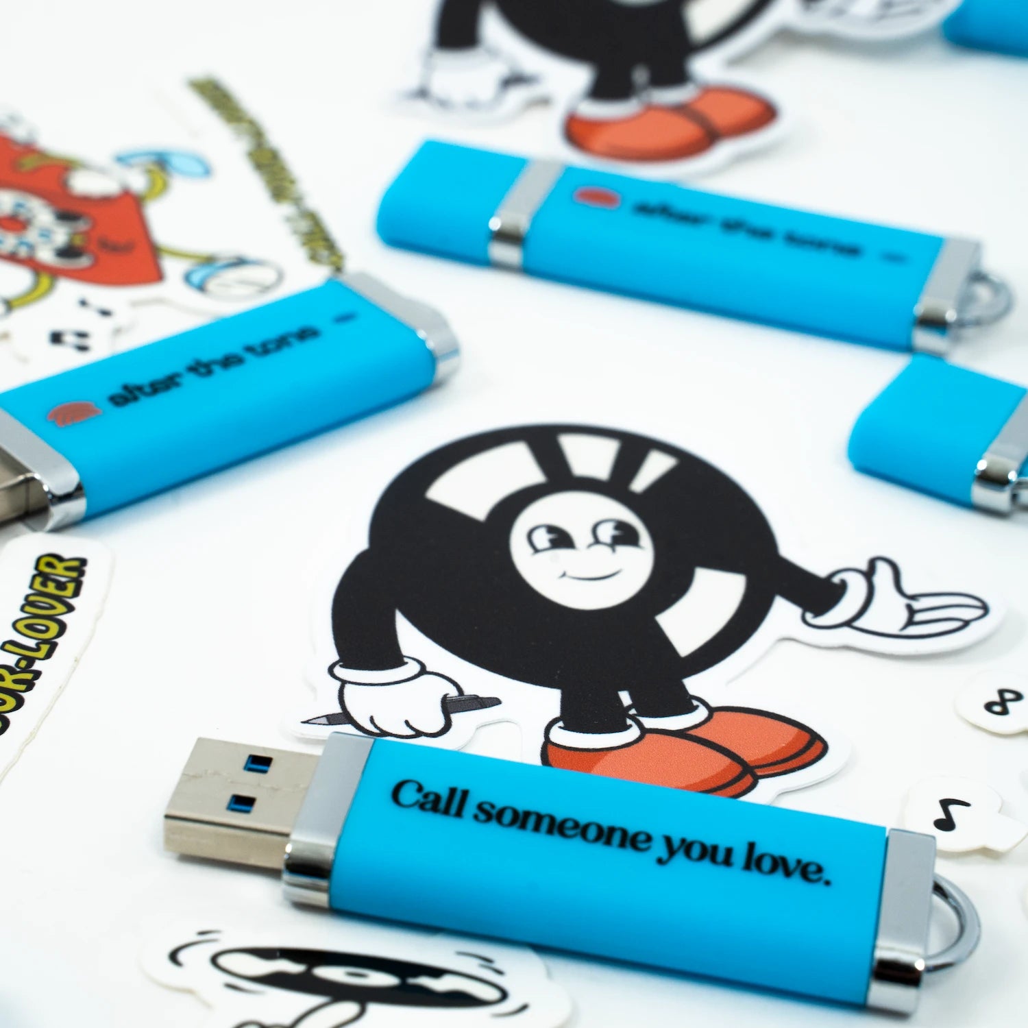 Blue USB drives with a cartoon character and text on a white background